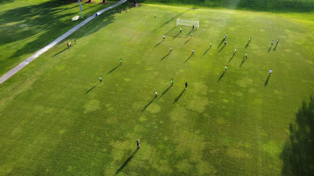 aerial view of teams playing soccer on the field