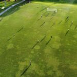 aerial view of teams playing soccer on the field